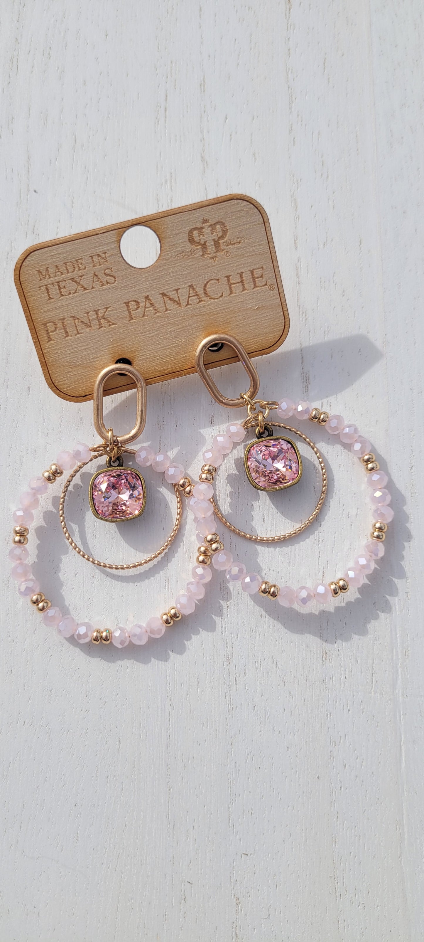 Pink Panache Earrings Color: Pink bead circle hoop with gold circle, 10mm bronze/light rose cushion cut drop on gold oval shape post earring Limited supply!   