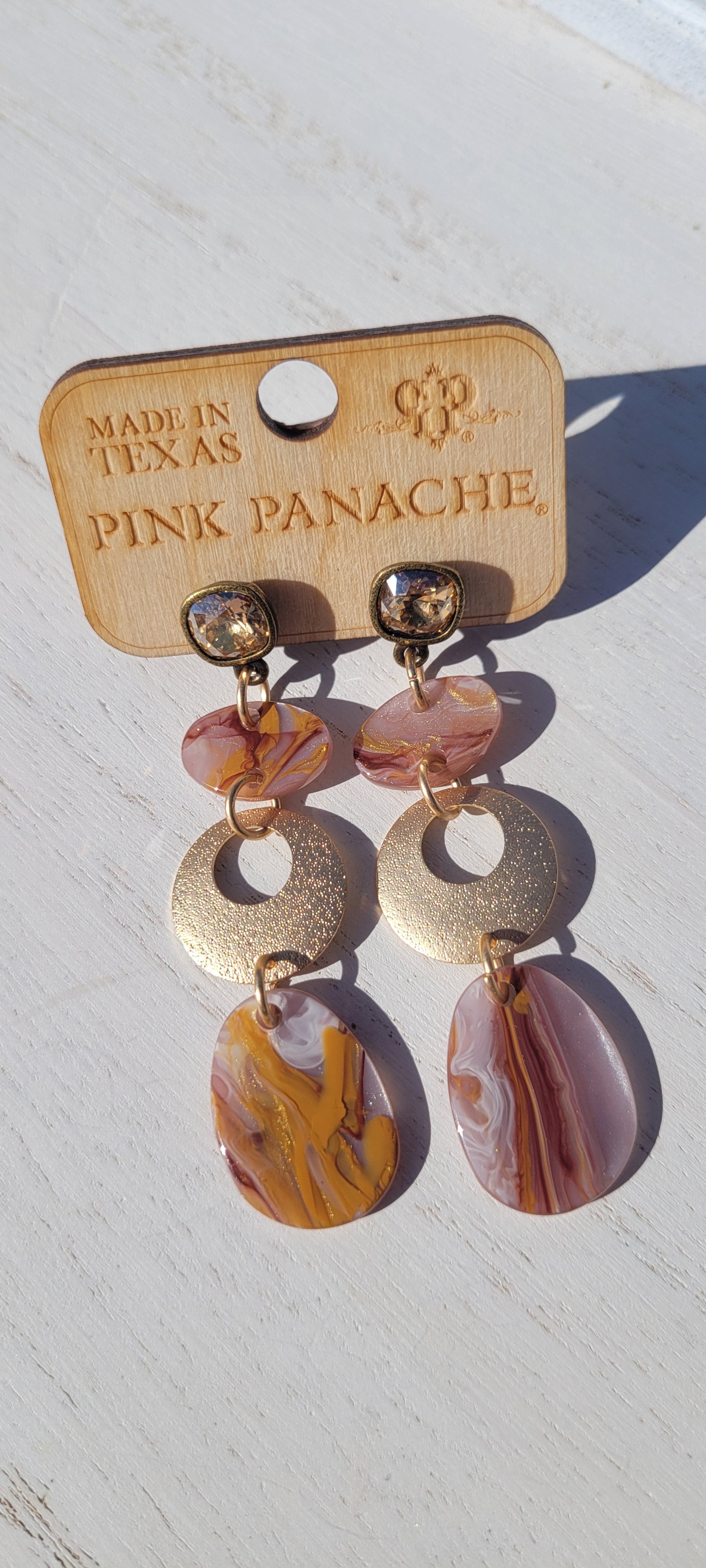 Pink Panache Earrings Color: 8mm bronze/golden shadow cushion cut post with brown acrylic swirl and gold circle triple drop earring Limited supply! 