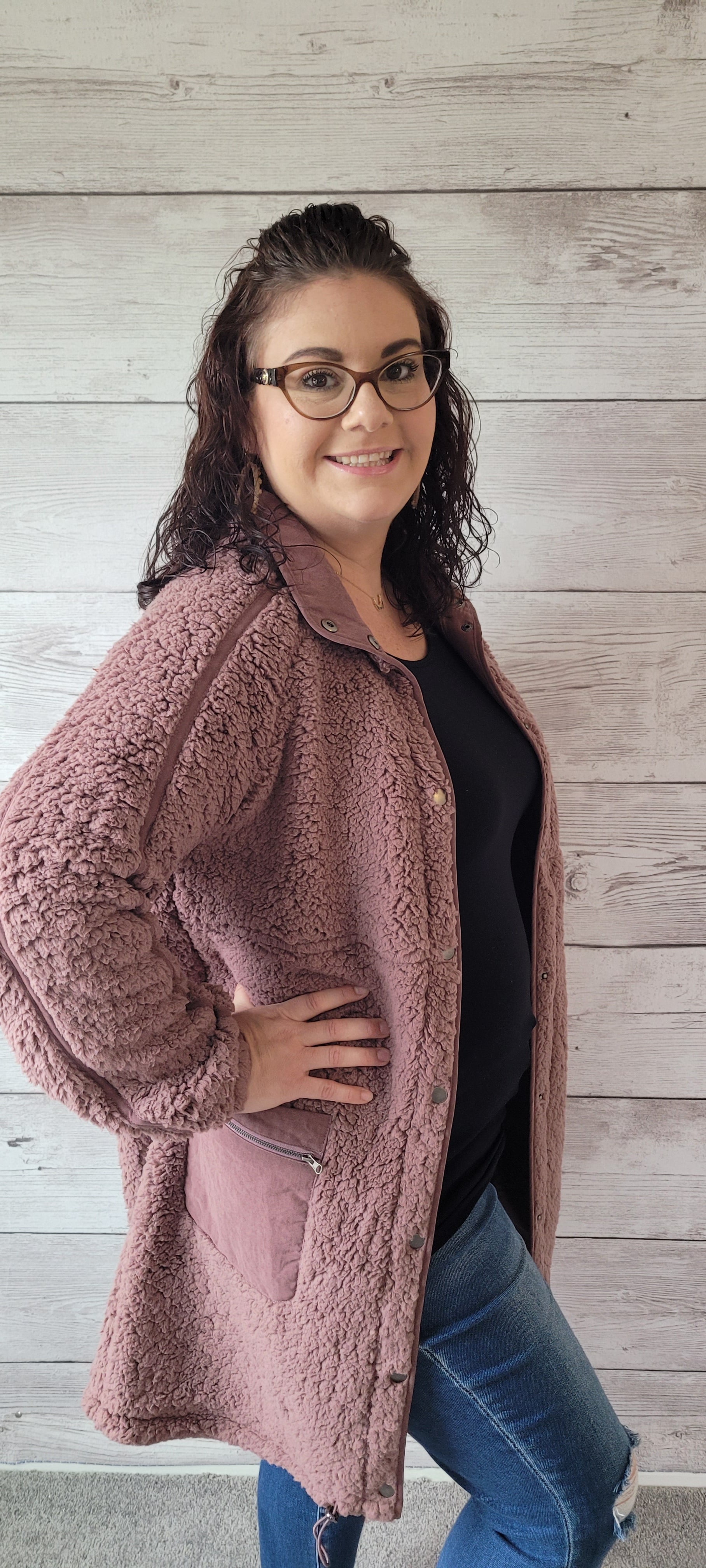 Keep snug and stay stylish with the "Maggie Mauve Fleece Jacket"! With metal snap button front closure, zippered pockets, contrast trim, and drawstring hem, you'll look totally 'snow'-tastic! Cozy up and stay oh-so chic! Sizes small through large.