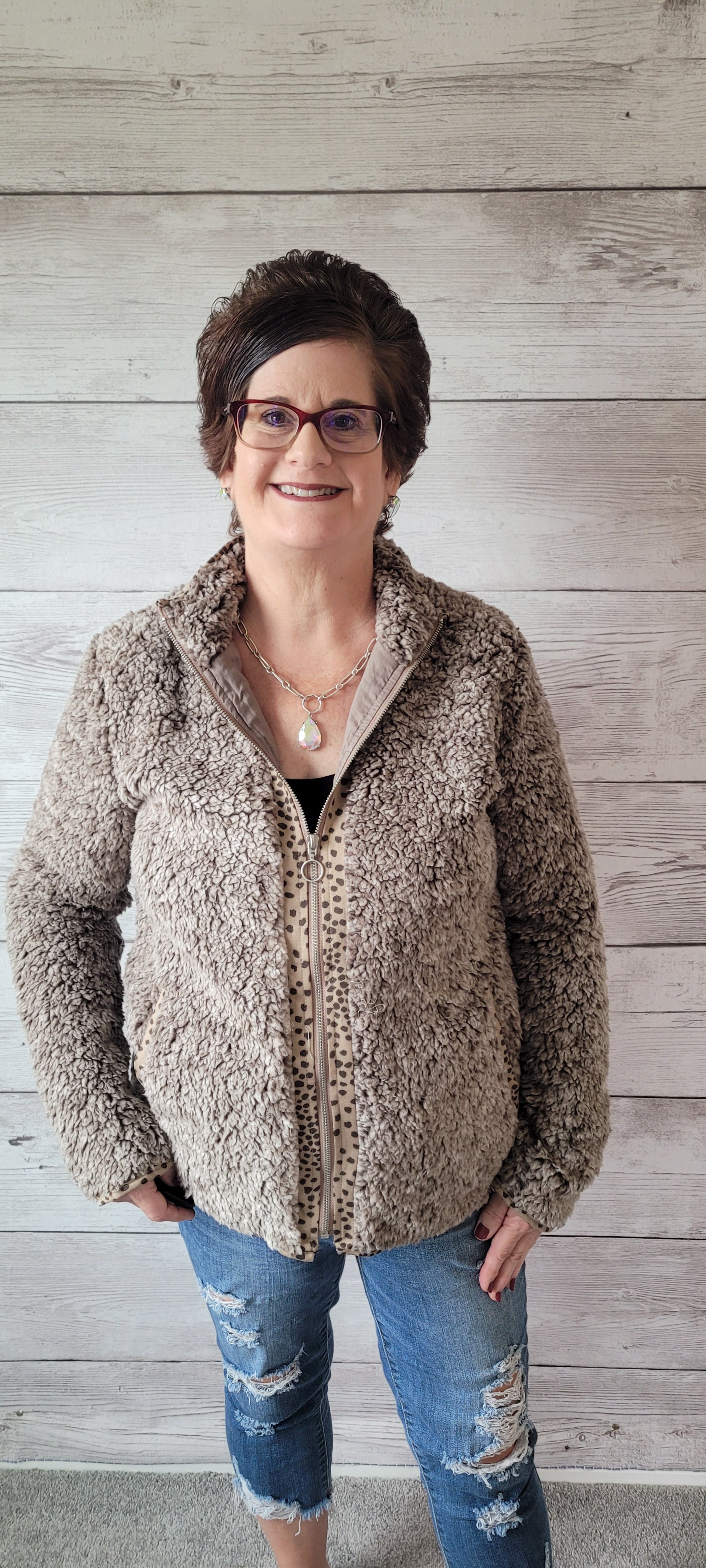 Stay warm and stylish with the "Brooke Olive Fleece Jacket"! Perfect for those chilly days, this cozy and oh-so-soft jacket has printed trim detail, side pockets, and a lined interior. It's zipped-up fun with a fashion twist! Sizes small through large.