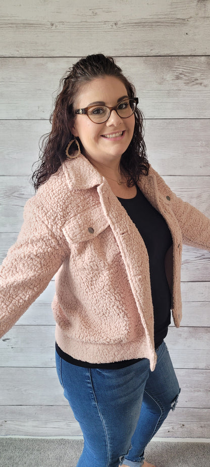 The perfect winter companion has arrived! Look no further than this "Daphne Blush Fleece Jacket", featuring a button-down front closure and flap pockets to keep you cozy. Step out in style this season with a jacket that'll keep you looking fresh while beating the chill! Who could ask for more? Sizes small through large.