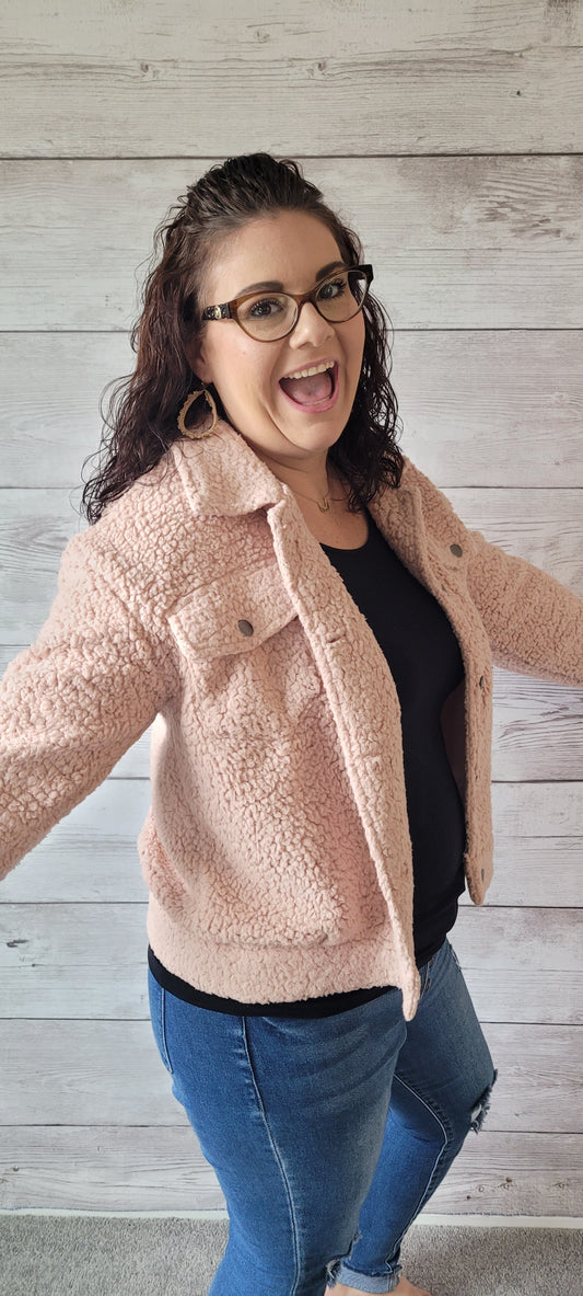 The perfect winter companion has arrived! Look no further than this "Daphne Blush Fleece Jacket", featuring a button-down front closure and flap pockets to keep you cozy. Step out in style this season with a jacket that'll keep you looking fresh while beating the chill! Who could ask for more? Sizes small through large.