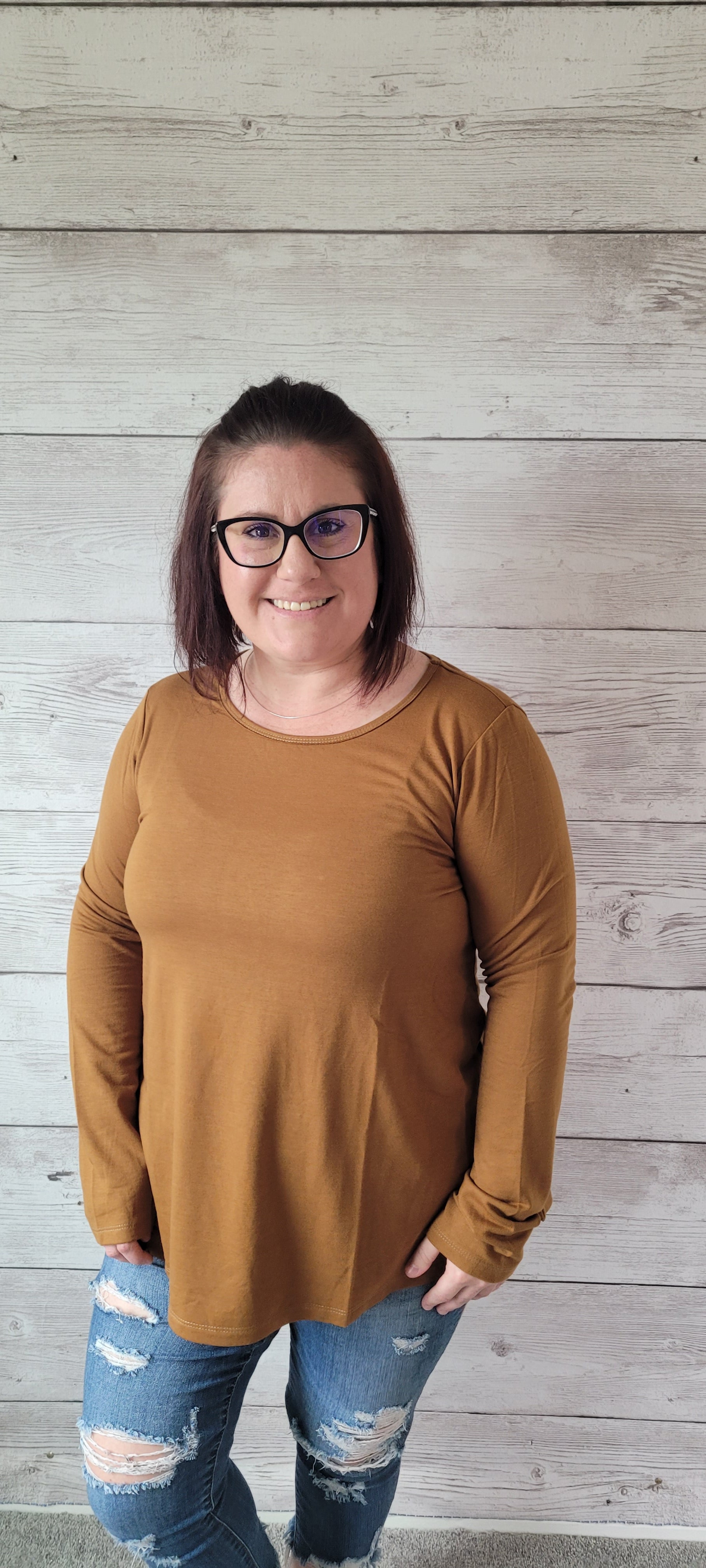 Ready for layering in style? Look no further than our Olivia French Terry Camel Top! With its cute scoop neckline and rounded hemline, you'll be looking cozy and chic all season long. Perfect for adding pizzazz to any outfit, this hip top will keep you comfy and stylish! Sizes small through large.