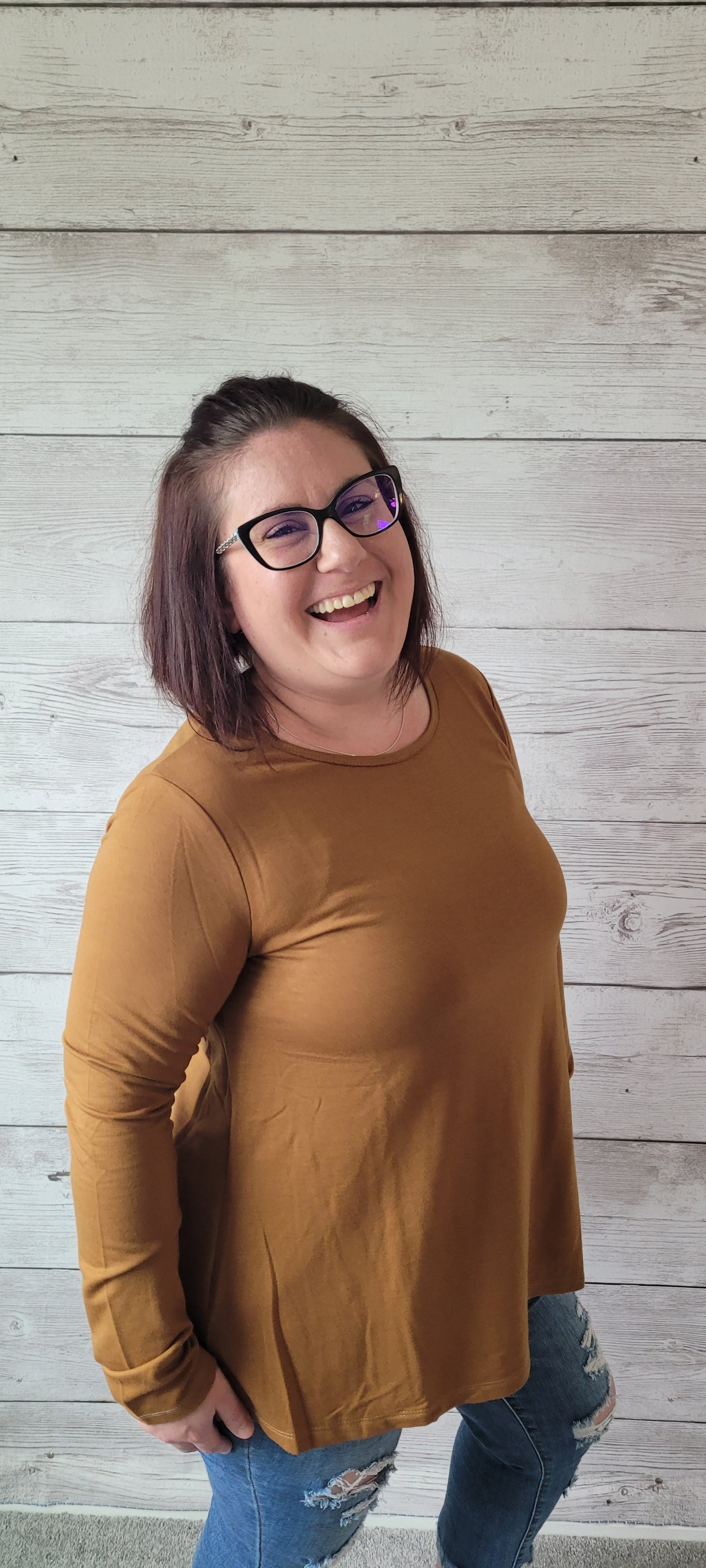Ready for layering in style? Look no further than our Olivia French Terry Camel Top! With its cute scoop neckline and rounded hemline, you'll be looking cozy and chic all season long. Perfect for adding pizzazz to any outfit, this hip top will keep you comfy and stylish! Sizes small through large.