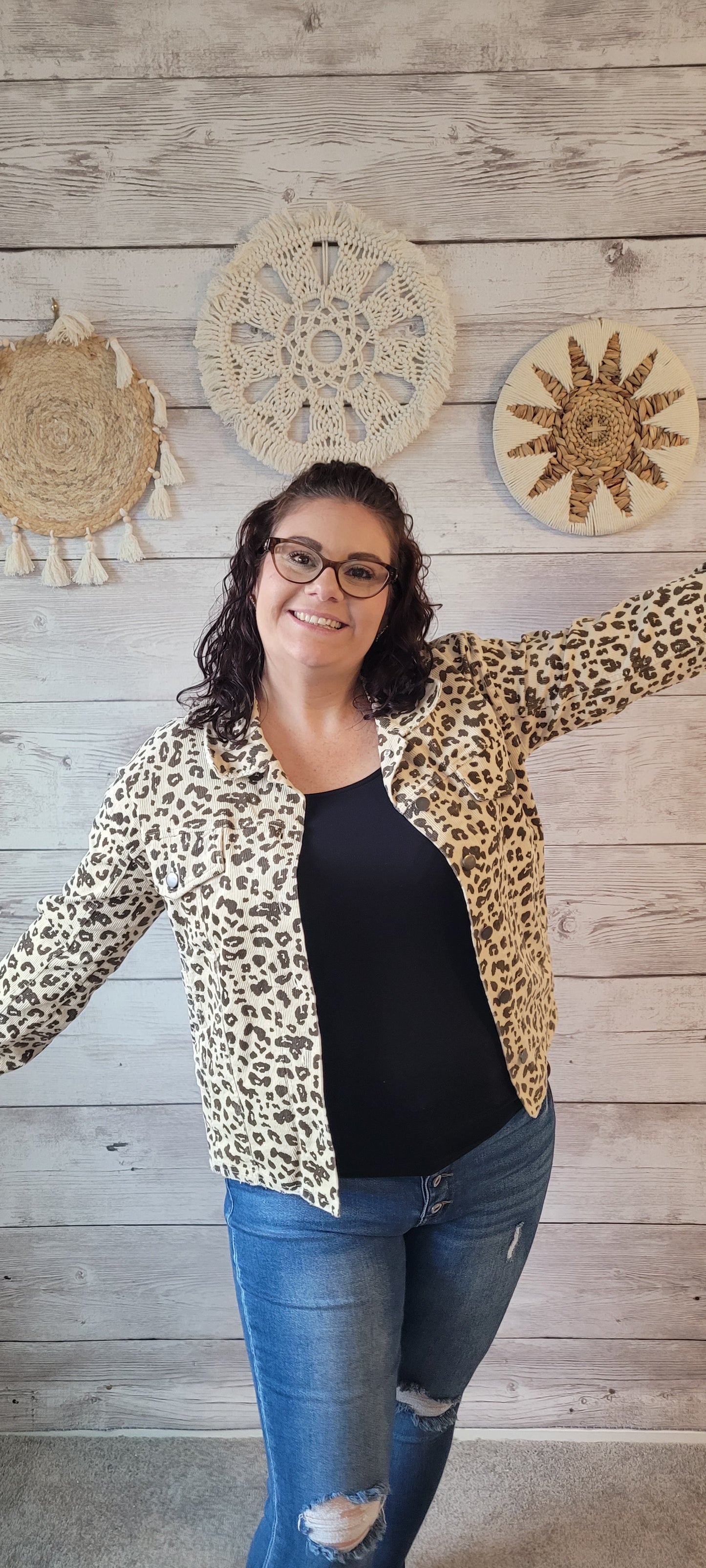 Cozy up in this out-of-the-ordinary "Emerie Ivory Washed Leopard Trucker Jacket". A fashion statement with flair, this frayed-edge beauty features metal button front closure and plenty of pockets for your stuff. Put it on and get ready to roar! Sizes small through large.