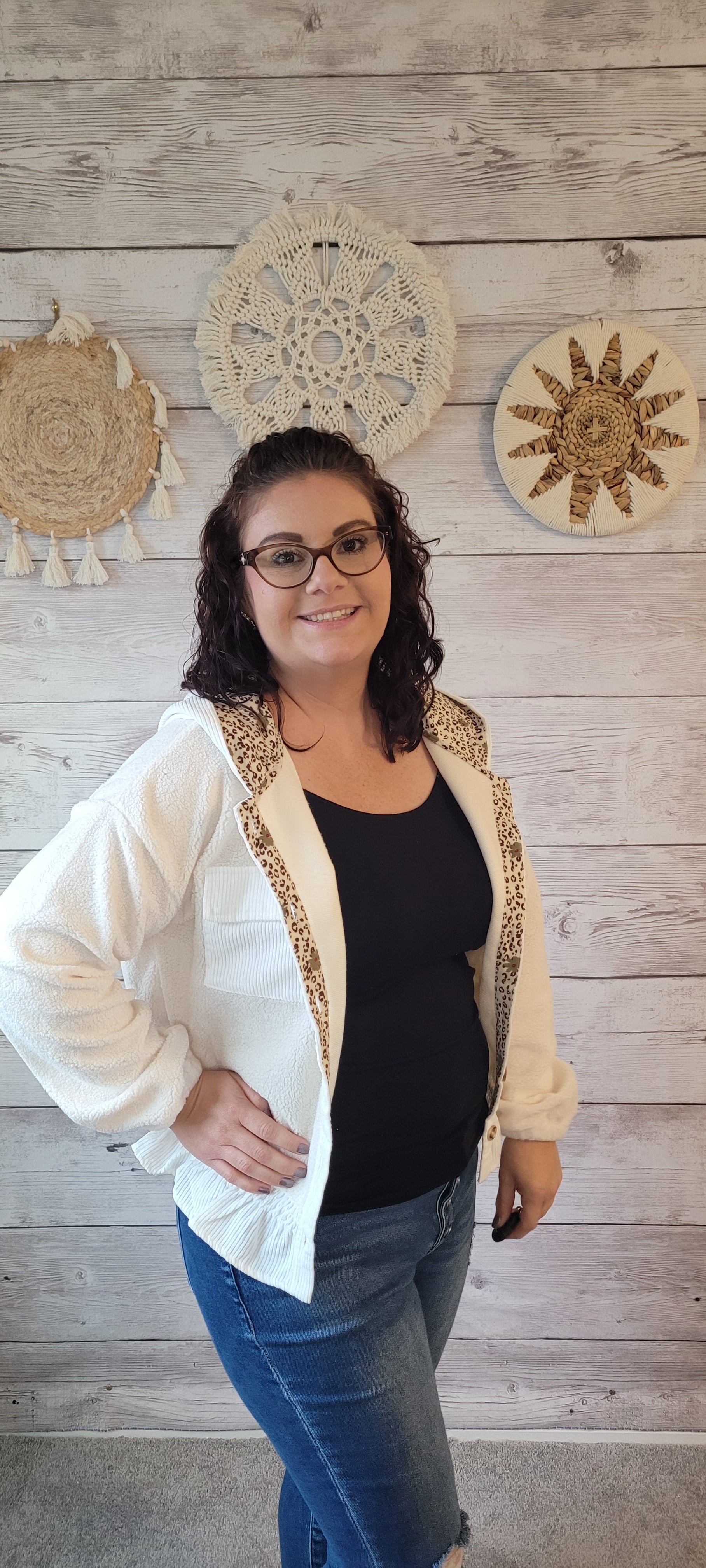 Stay cozy and stylish in the Margo Ivory Sherpa Hoodie Jacket! Crafted with practical details like a button-down front and functional hood, this peplum-style jacket will become your favorite go-to for cool days. The ivory fabric is lined with a bold leopard and floral print, adding a fun, fashionable twist. Get ready to cuddle up! Sizes small through large.