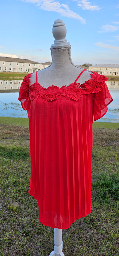 This stunning red pleated dress will make you want to go out dancing. It features flowy sleeves, adjustable spaghetti straps, cold shoulders, floral trim, and lining inside. It is shear, but not see through. Good for a night out with the girls! Don’t be afraid to get creative! Sizes small through large.