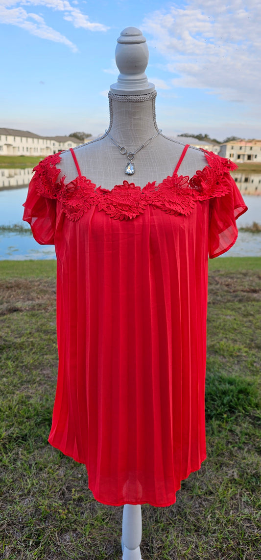 This stunning red pleated dress will make you want to go out dancing. It features flowy sleeves, adjustable spaghetti straps, cold shoulders, floral trim, and lining inside. It is shear, but not see through. Good for a night out with the girls! Don’t be afraid to get creative! Sizes small through large.
