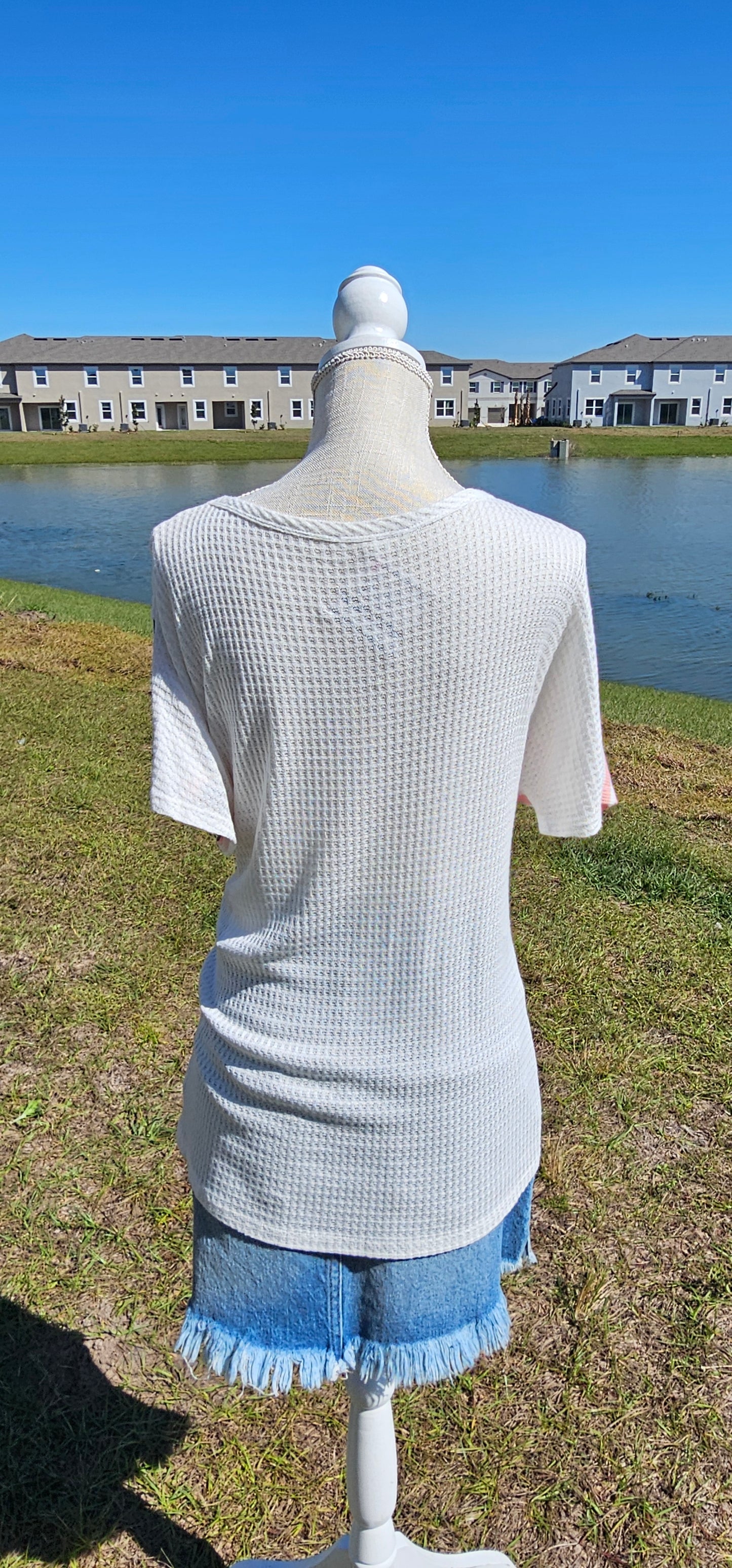 “Spoken From The Heart” is a comfy and casual t-shirt! This short sleeve shirt features pattern blocking, leopard print (pink, gray, white), stripes (coral, white) and solid waffle (white). This shirt has three different materials and textures, and a rounded neckline. Pair with your favorite pair of denim jeans, shorts, or skirt. Sizes small through large.