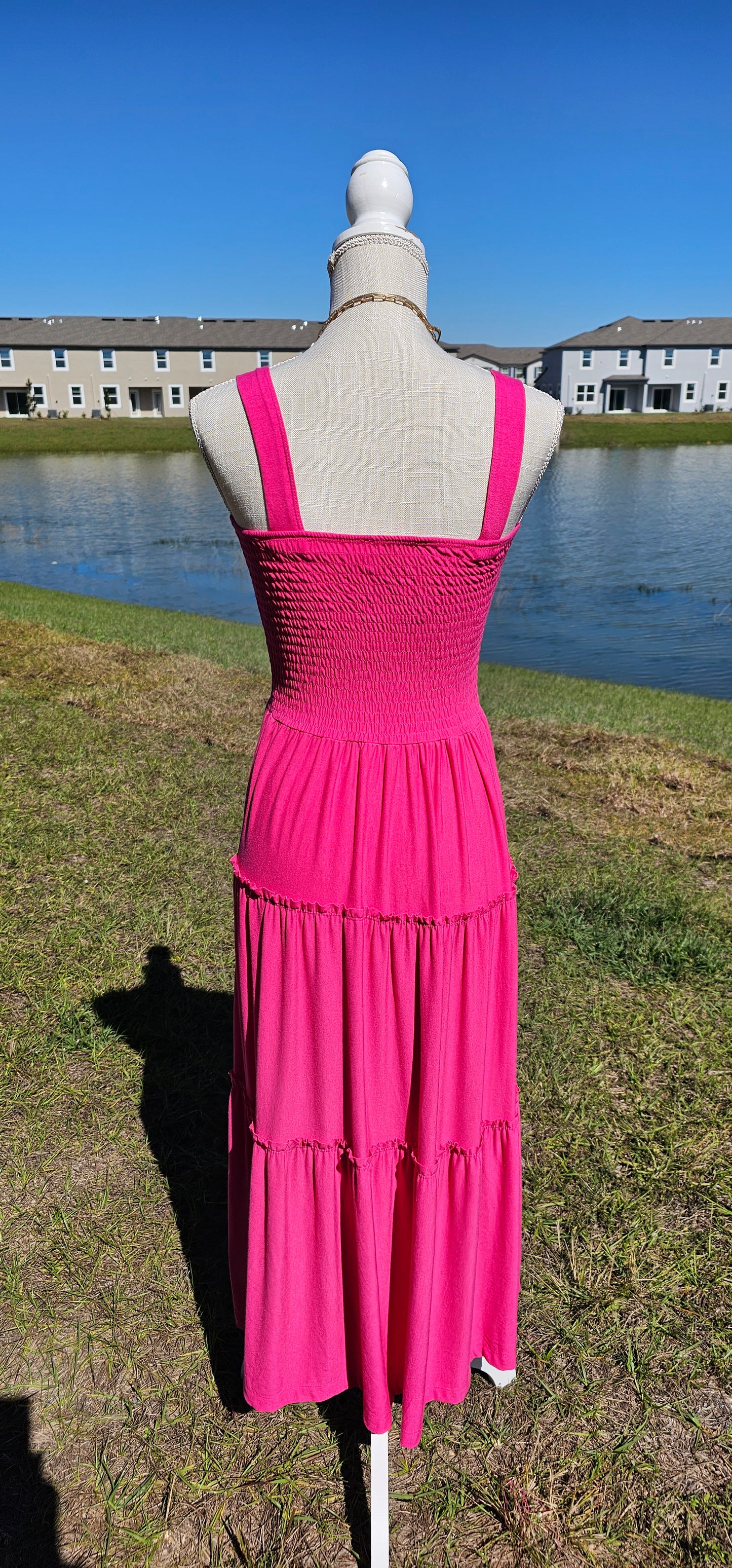 Pink smocked tiered midi dress, square neck, smocked top, wide straps. Sizes small through x-large.