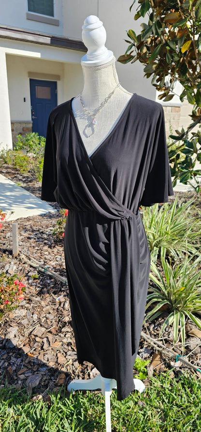 Style your look with this midi flutter sleeve dress. It features a surplice neckline and asymmetrical detail, making it a versatile style that's perfect for work or weekend wear. Sizes small through 3x-large.