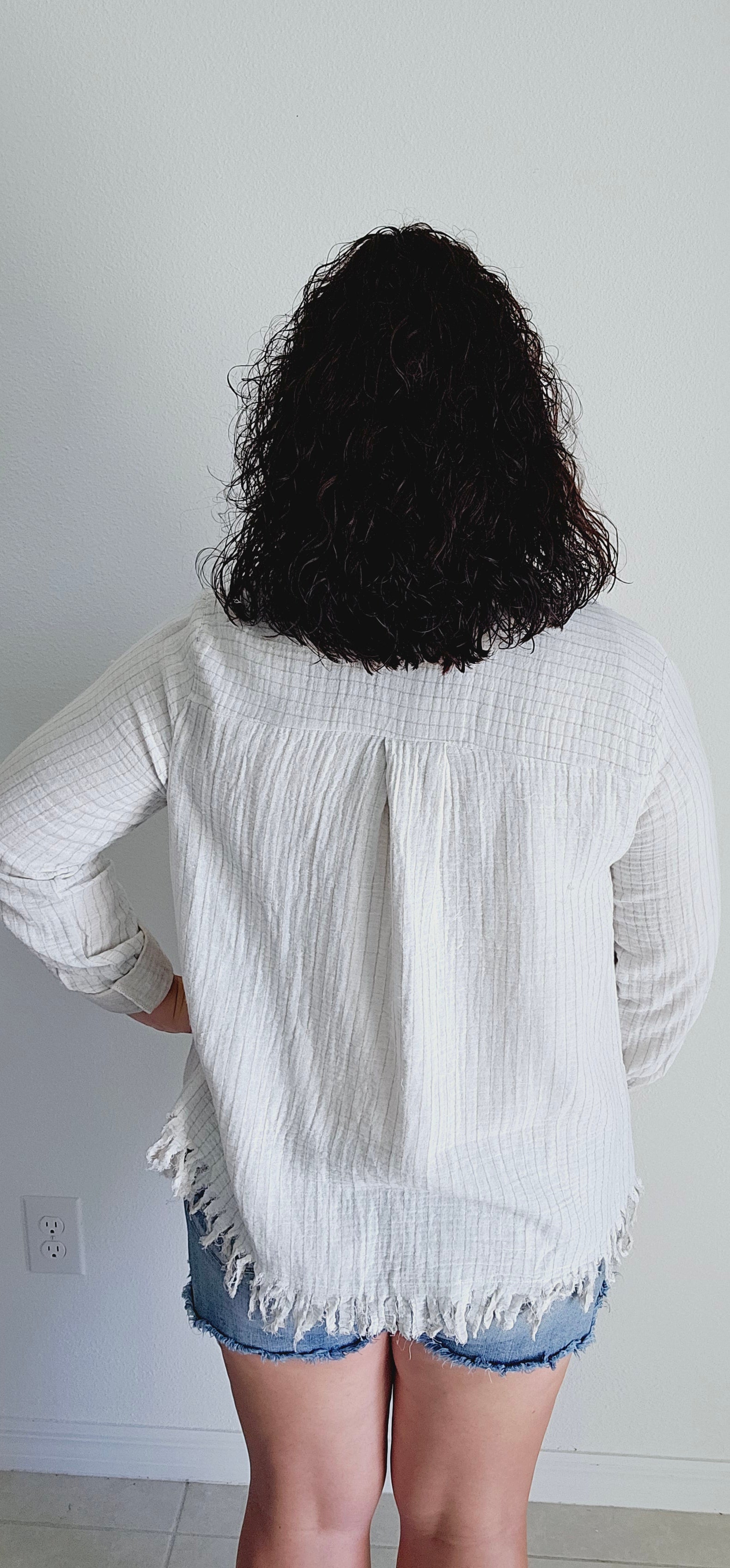 Meet the perfect blend of playful and practical - striped fringe hem cardigan! With its trendy striped design and raw fringe hem, you'll stand out in style. Plus, the rolled functional button cuff and collar add a touch of functionality to this unique piece. Stay effortlessly chic in this cardigan! Sizes small through large.