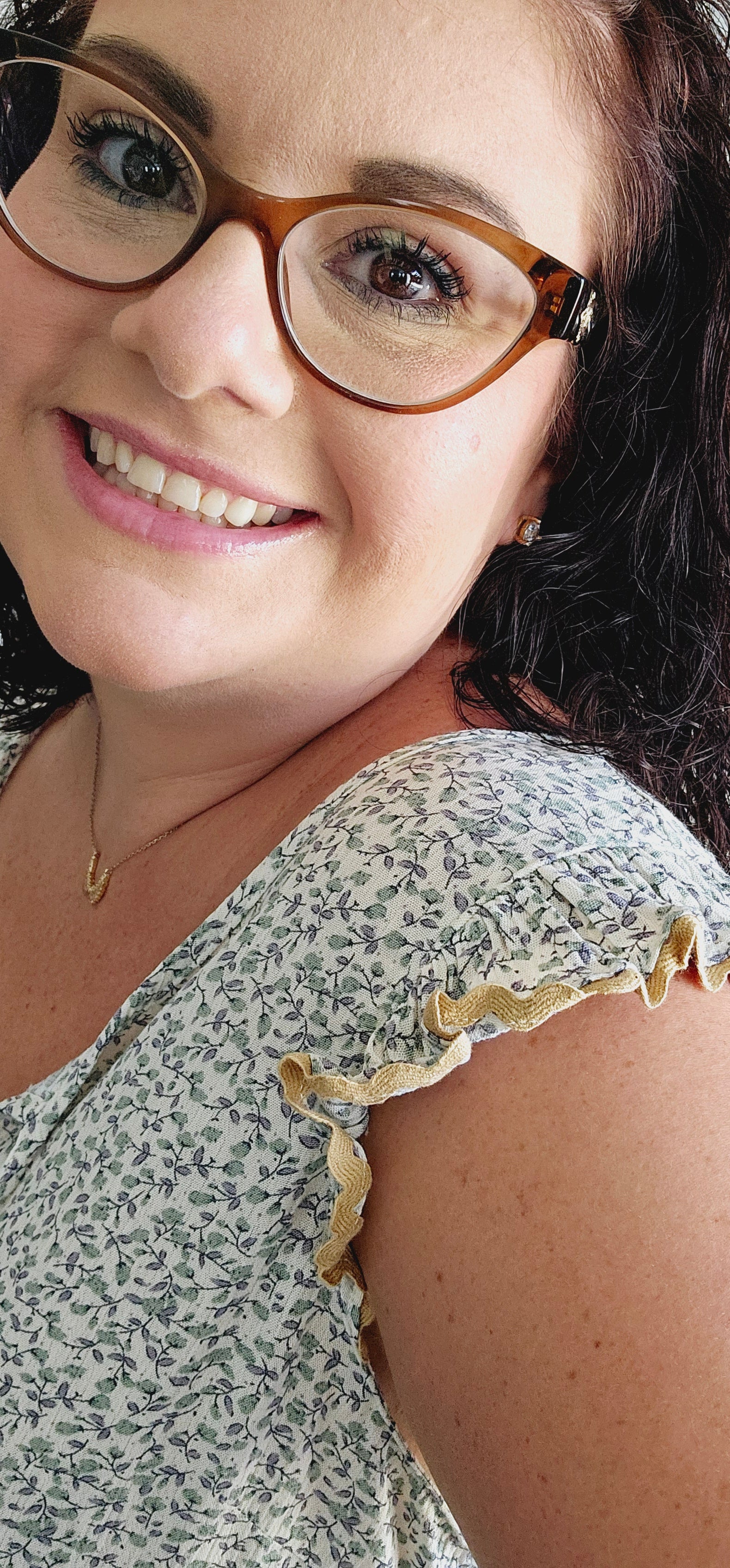 This fun and flirty blouse features a playful ditsy floral pattern and charming scalloped mustard trim. The ruffle sleeves add a touch of whimsy, while the tie closure with mustard tassels offers a unique and stylish detail. Perfect for a quirky and playful look. Sizes small through large.