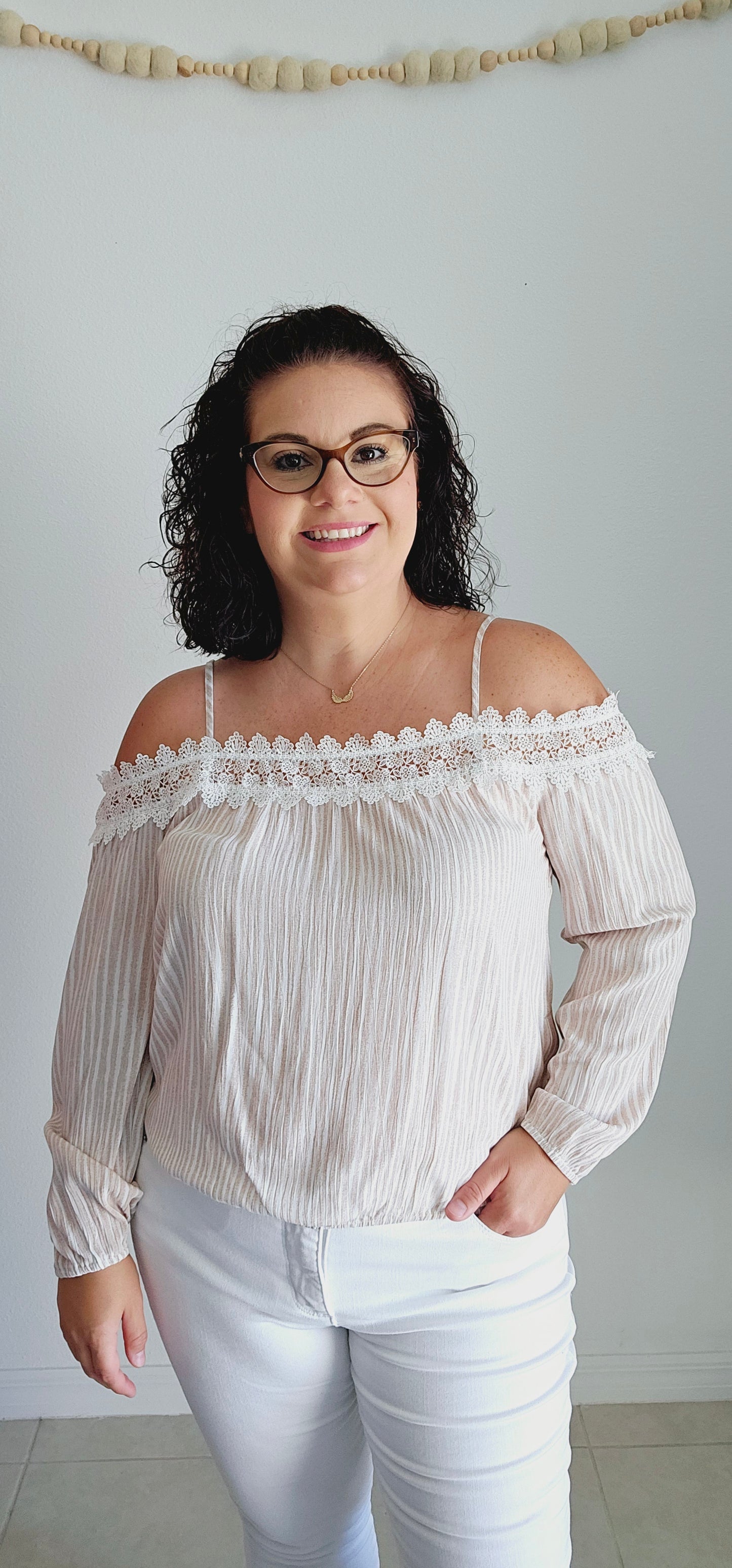 Unleash your playful side with this adorable top! This tan and off-white top features delicate lace trim and a fun bubble silhouette, making it perfect for any occasion. Embrace a unique and quirky style with this statement piece. Sizes small through large.