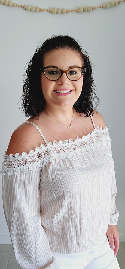 Unleash your playful side with this adorable top! This tan and off-white top features delicate lace trim and a fun bubble silhouette, making it perfect for any occasion. Embrace a unique and quirky style with this statement piece. Sizes small through large.