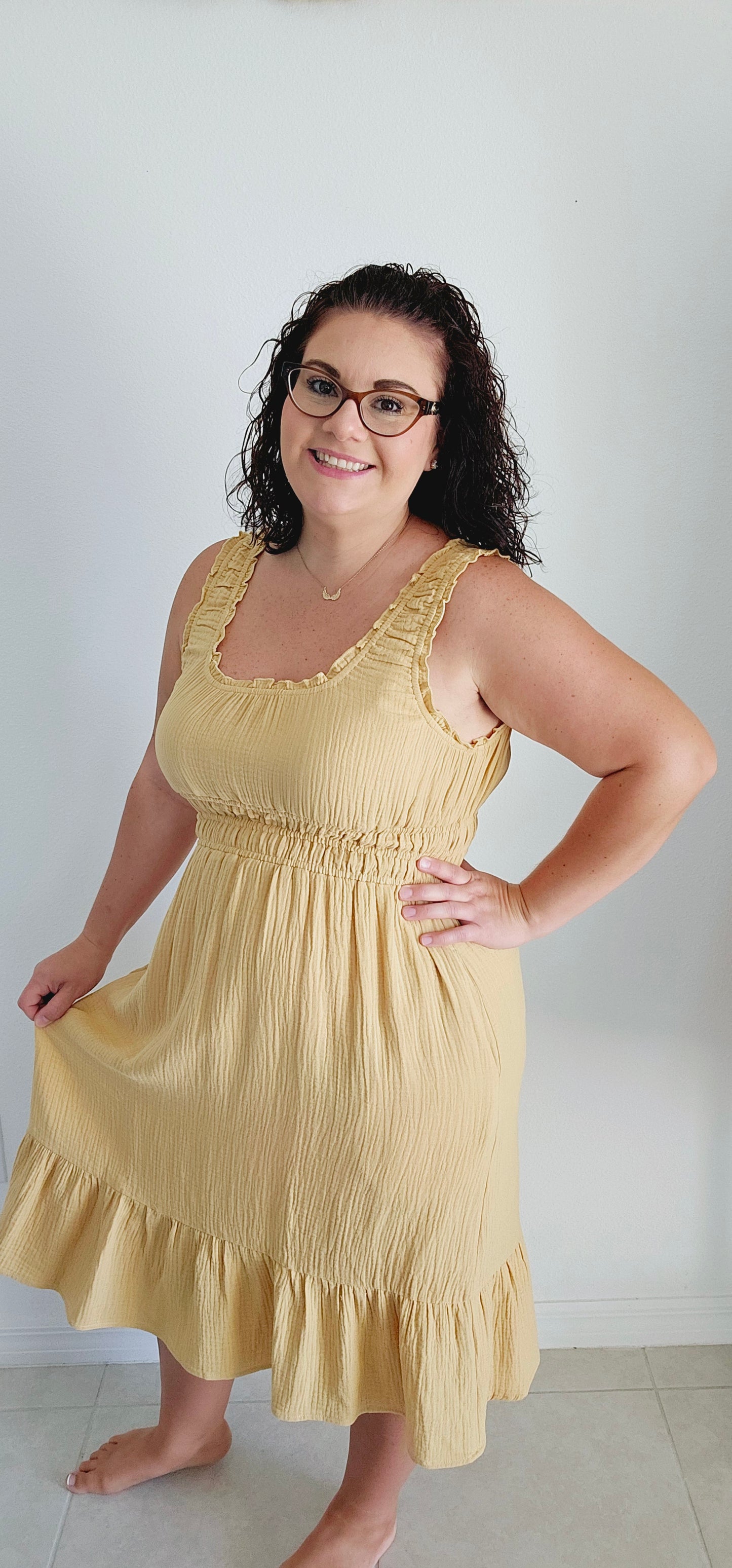 Get ready for a summer sensation with the Delilah tiered gauze midi dress! Made with lightweight cotton gauze, this dress features shirring, ruffles, and elastic for a perfect fit. Plus, pockets for convenience. It's the perfect dress for a fun and playful look. Sizes small through large.