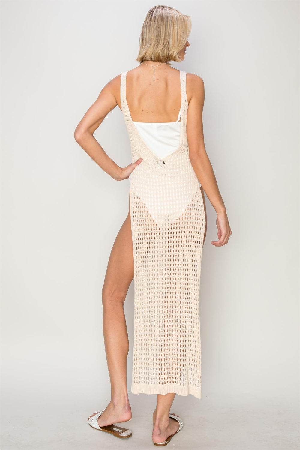 This crochet backless cover-up dress is a stunning and stylish addition to your summer wardrobe. The delicate crochet details add a feminine touch, while the backless design adds a touch of sensuality.  S  - L
