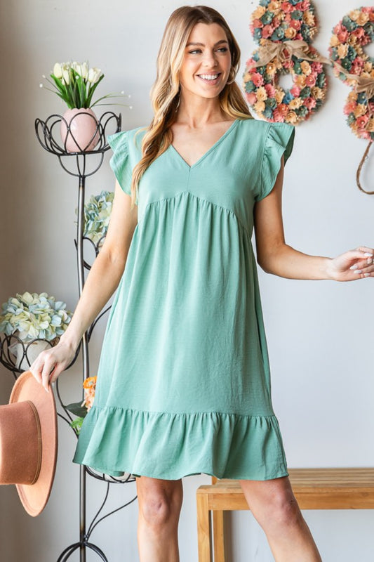Exude feminine charm in this Short Sleeve V Neck Ruffled Hem Dress, featuring a flattering V-neckline and delicate ruffled hem for a touch of elegance. The short sleeves offer a breezy and stylish look, perfect for warmer days or special occasions. This dress is designed to provide both comfort and sophistication with its soft fabric and flattering silhouette. S-3X