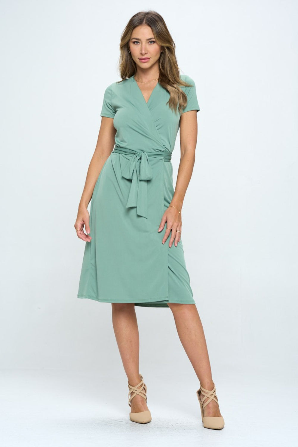 This tie front surplice short sleeve dress is a fabulous addition to your summer wardrobe. The surplice neckline creates a flattering silhouette while adding a touch of sophistication. The tie front detail at the waist adds a stylish and trendy element to the dress.  S  - L