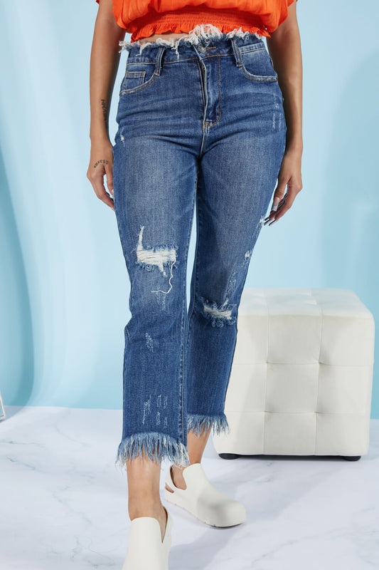 These straight leg jeans really amplify the "undone" look that you're trying to achieve. Not only do these jeans have distressing details throughout the body of the jeans, and at the hem, but also at the waist! To emphasize that unique feature, wear these jeans with a crop top. These are a medium wash. Sizes 5-11.
