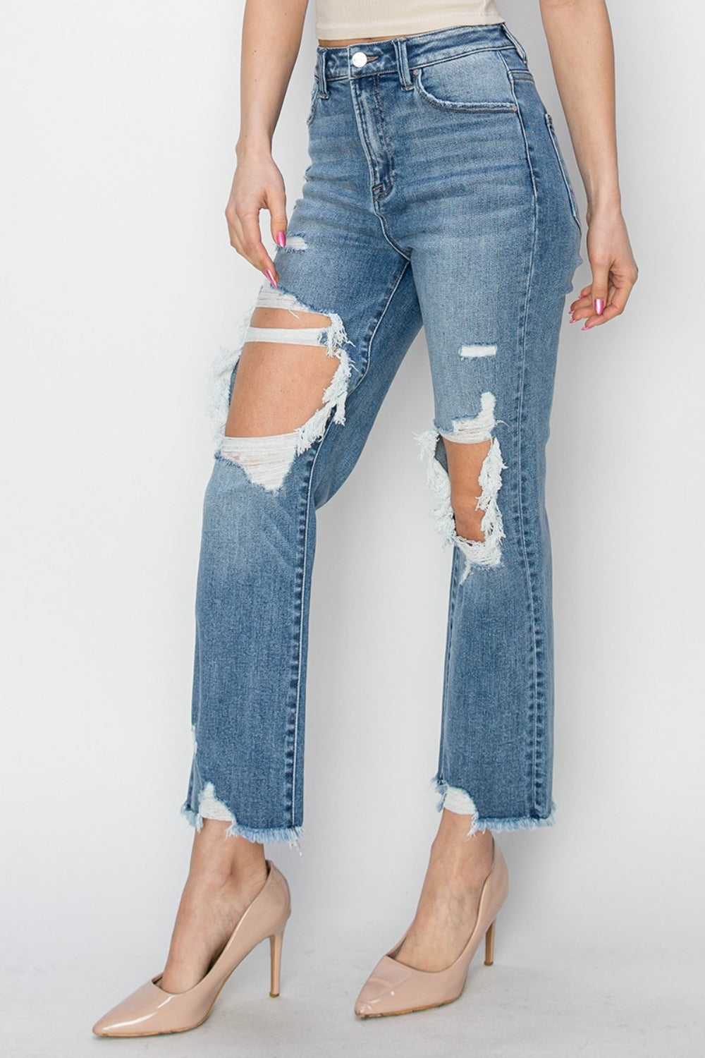 High Rise Distressed Crop Straight Jeans are a trendy and versatile wardrobe essential. The high rise design offers a flattering fit that accentuates the waist and elongates the legs. The distressed detailing adds a touch of edgy charm to the jeans, giving them a cool and casual vibe. The cropped length is perfect for showcasing your favorite shoes and adding a modern touch to your outfit. 0-15