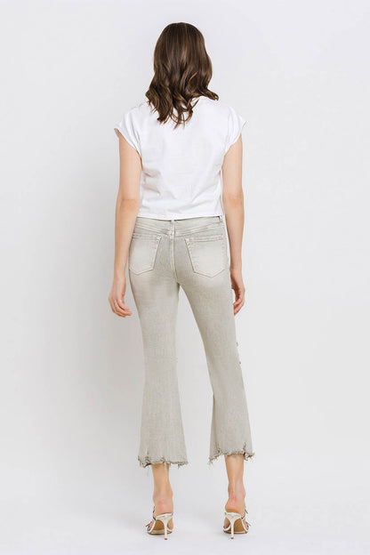 These distressed raw hem cropped flare jeans offer a perfect blend of edgy and retro style. The distressed detailing adds a touch of urban flair to the flared silhouette. The raw hem finishes off the look with a trendy, unfinished edge. Pair these jeans with a tucked-in graphic tee and platform sandals for a vintage-inspired outfit.  24-32