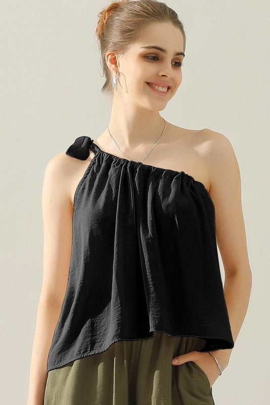 This elegant top features a unique one shoulder design with a bow tie strap, adding a touch of femininity to any outfit. Made from luxurious satin silk, it offers a smooth and luxurious feel against the skin. Perfect for both casual and formal occasions, this top is versatile and effortlessly stylish. S  - XL