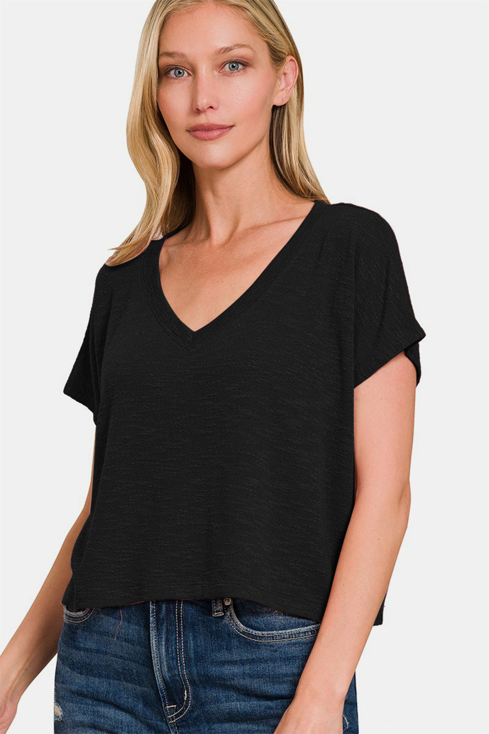 This V-Neck Short Sleeve Crop T-Shirt is a trendy and versatile piece for your wardrobe. The V-neck design adds a flattering touch to the top. With its short sleeves and cropped length, this t-shirt is perfect for warmer weather or for layering. Pair it with high-waisted bottoms for a stylish and on-trend look. Add a touch of casual flair to your outfit with this crop t-shirt that can easily be dressed up or down. Update your collection with this fashionable and comfortable V-neck crop t-shirt. S-XL