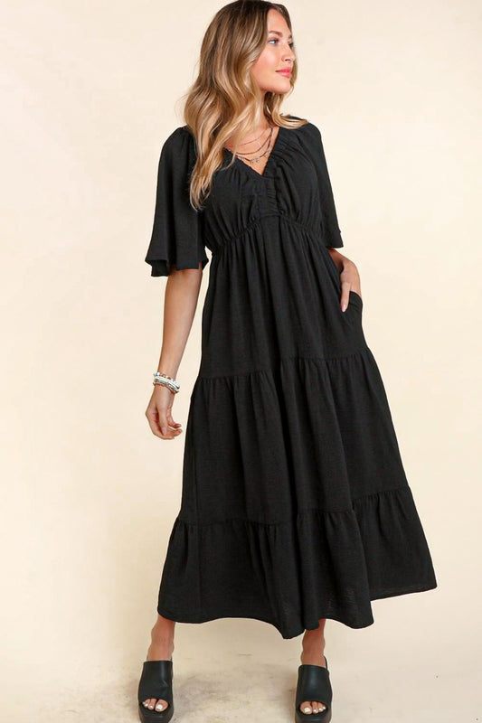 The Tiered Babydoll Maxi Dress with Side Pocket is the epitome of bohemian charm and effortless style. With its flowy tiered skirt and flattering babydoll silhouette, this dress exudes a romantic and carefree vibe. The addition of a convenient side pocket adds a practical element to the whimsical design.  S-L