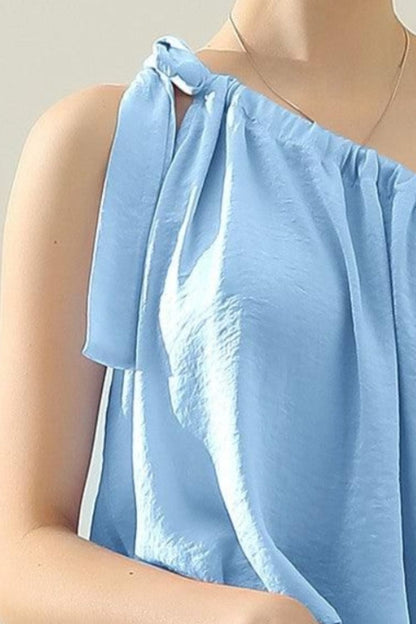 This elegant top features a unique one shoulder design with a bow tie strap, adding a touch of femininity to any outfit. Made from luxurious satin silk, it offers a smooth and luxurious feel against the skin. Perfect for both casual and formal occasions, this top is versatile and effortlessly stylish. S  - XL