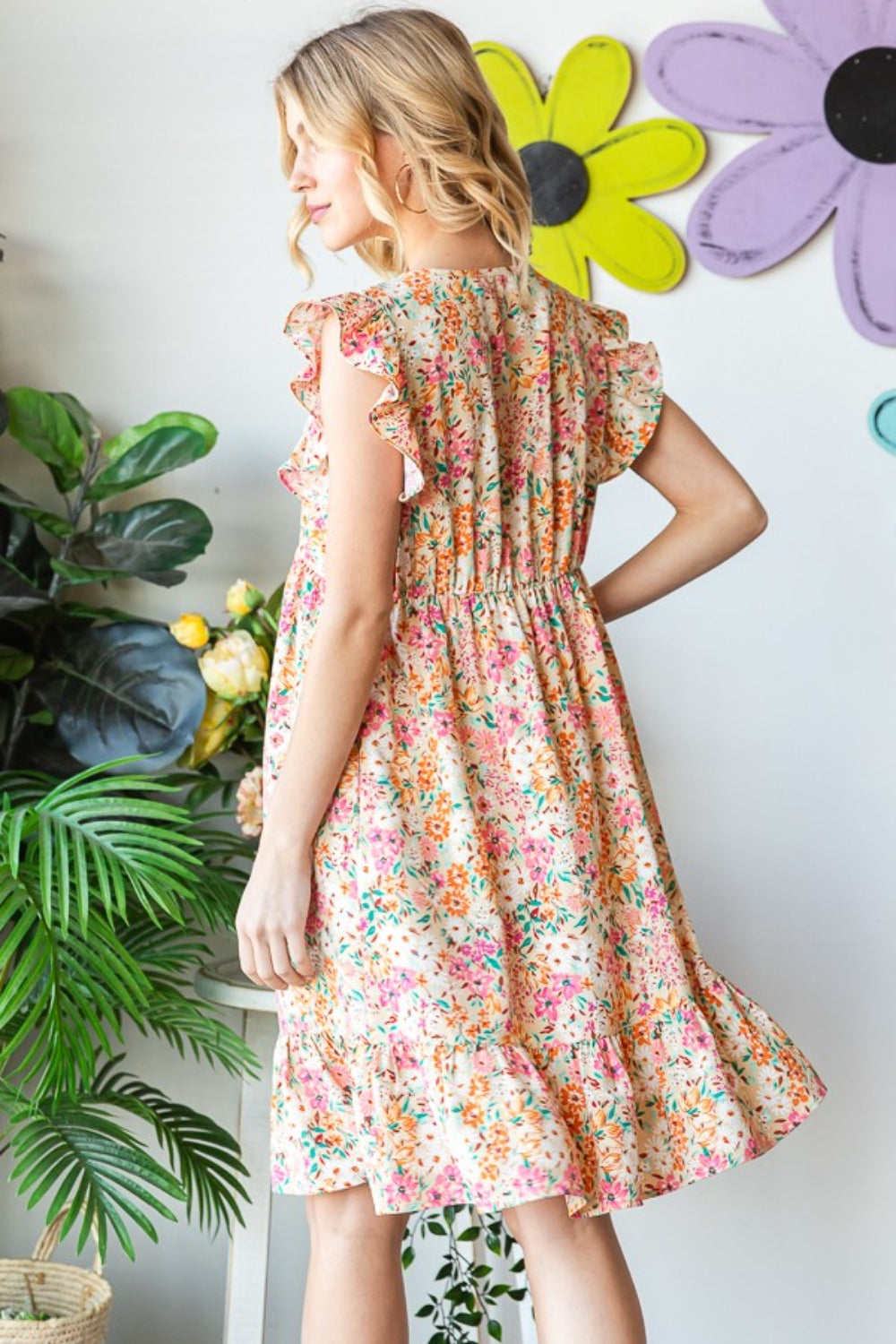 Introducing the Floral Ruffled V-Neck Dress. This stunning dress combines feminine elegance with a touch of playfulness. The floral pattern adds a romantic and vibrant flair, while the ruffled details create a whimsical and graceful look. S  - 3X