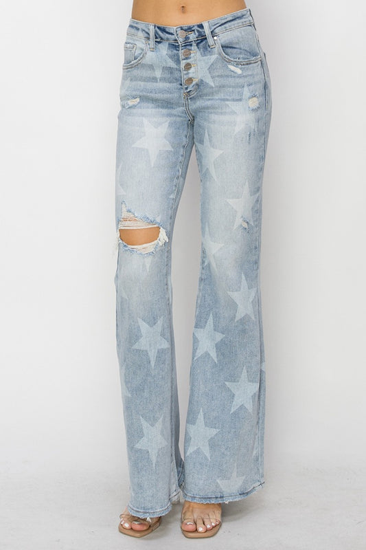 These Mid Rise Button Fly Star Print Flare Jeans are a unique and trendy addition to your denim collection. The mid-rise fit offers a flattering and comfortable silhouette, while the button fly adds a touch of vintage charm.  0 - 15