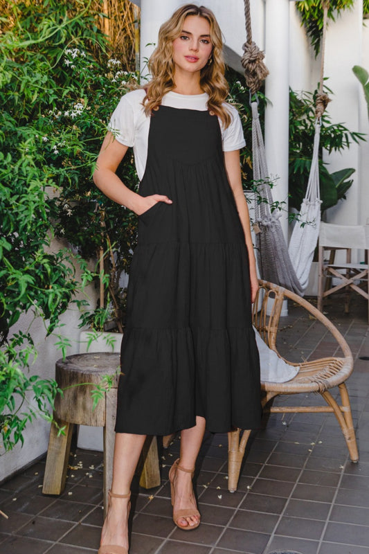 Make a statement in this Sleeveless Tiered Midi Dress, featuring a flattering and flowy tiered design that exudes both style and sophistication. The sleeveless silhouette allows for ease of movement and breathability, making it perfect for warm-weather occasions. Crafted from high-quality fabric, this midi dress offers a comfortable and elegant fit that is sure to turn heads.  S-3X