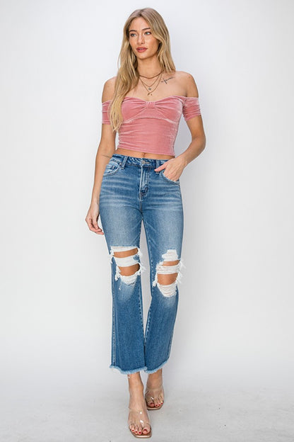 These Mid Rise Distressed Cropped Flare Jeans are a trendy and edgy addition to your denim collection. The mid-rise fit offers a flattering and comfortable silhouette, while the distressed detailing adds a touch of rugged charm.  0 -15