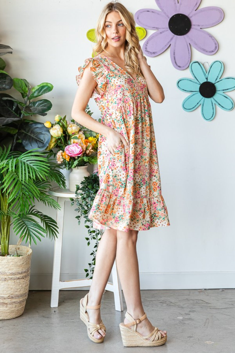 Introducing the Floral Ruffled V-Neck Dress. This stunning dress combines feminine elegance with a touch of playfulness. The floral pattern adds a romantic and vibrant flair, while the ruffled details create a whimsical and graceful look. S  -3X
