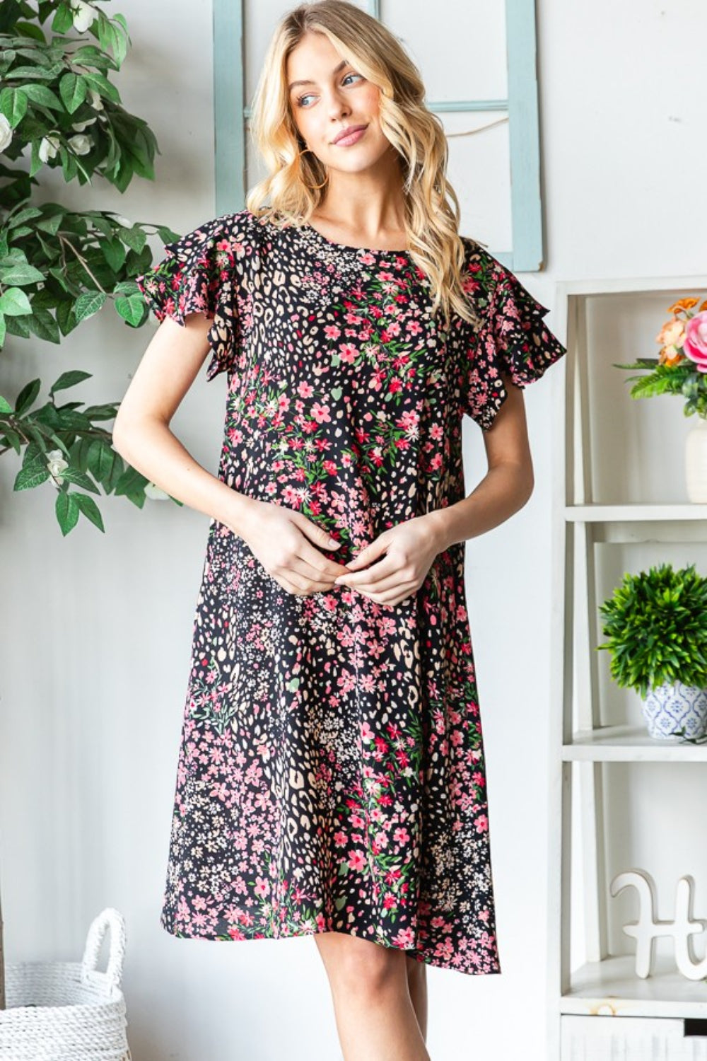 Get ready to turn heads in this stunning Printed Ruffled Short Sleeve Dress. With its eye-catching print and playful ruffled sleeves, this dress exudes feminine charm. The best part? It comes with pockets, adding a practical touch to this stylish piece. S  -3X