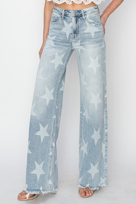 The Raw Hem Star Wide Leg Jeans are a fashionable and eye-catching choice for those looking to make a statement with their outfit. The raw hem detail gives these jeans a casual and edgy vibe, while the star embellishments add a touch of whimsical charm. The wide leg silhouette offers a comfortable and flattering fit, making them a versatile piece that can be dressed up or down. 0 -3X