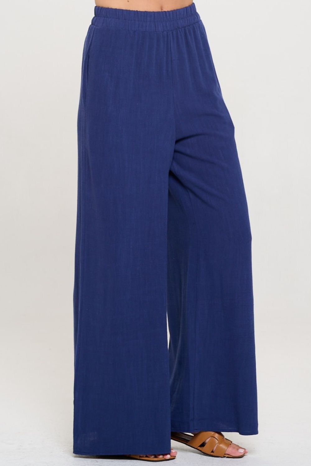 These linen wide leg pants are stylish  S - Land functional with the added convenience of pockets. Made from breathable linen fabric, they are perfect for keeping cool and comfortable during warm weather. The wide leg design adds a touch of elegance while allowing for ease of movement. 