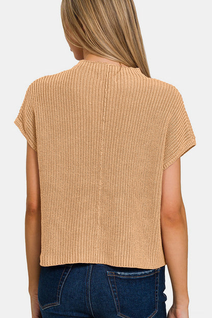 The Mock Neck Short Sleeve Cropped Sweater is a trendy and versatile piece for your wardrobe. With its mock neck design, this sweater adds a modern and chic touch to any outfit. The short sleeves make it perfect for transitioning between seasons or for layering with other pieces. S-L