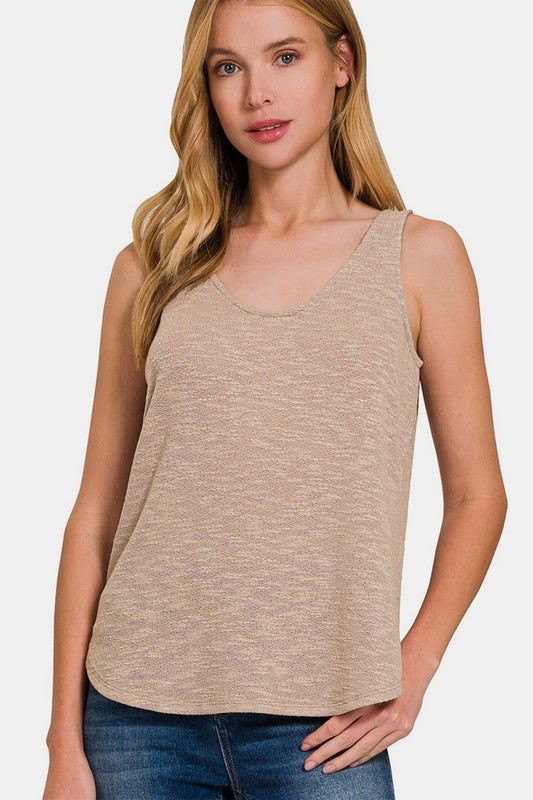 The Curved Hem Round Neck Tank is a simple and stylish crewneck vest that features an elegant curved hem. This vest is suitable for summer wear, so you can feel cool and comfortable. Pair it with denim shorts, skirts or sweatpants for a casual and chic everyday look. Designed to be sleek and comfortable, this vest is a must-have for your casual wardrobe, allowing you to show off your fashion sense and confidence at any time. S-L