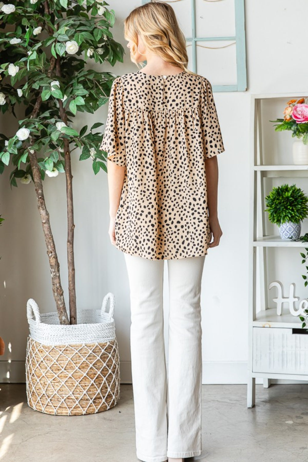 The Animal Print Flutter Sleeve Blouse is a chic and stylish top that combines the trendy animal print with feminine flutter sleeves. This blouse is perfect for making a fashion statement with its bold print and flirty sleeve design. The flutter sleeves add a touch of elegance and movement to the blouse, making it a versatile piece for both casual and dressy occasions.  S-3X