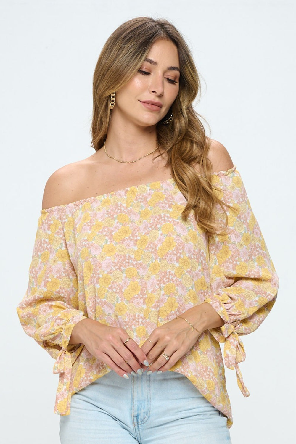 This floral off-shoulder long sleeve blouse is a stylish and feminine piece for any occasion. The off-shoulder design adds a flirty touch while showcasing your shoulders. The floral print gives a romantic and vibrant look to the blouse, perfect for spring or summer.  S - L
