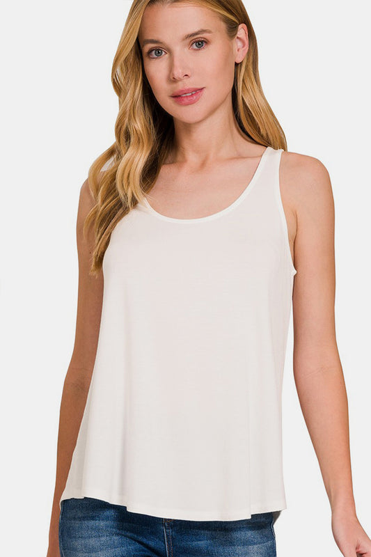 The Round Neck Flowy Hem Tank is a stylish and versatile clothing piece that features a flattering flowy hem design. It is perfect for casual outings or even dressed up with accessories for a more sophisticated look. The round neck adds a classic touch to the tank top, making it easy to pair with different bottoms. S-XL