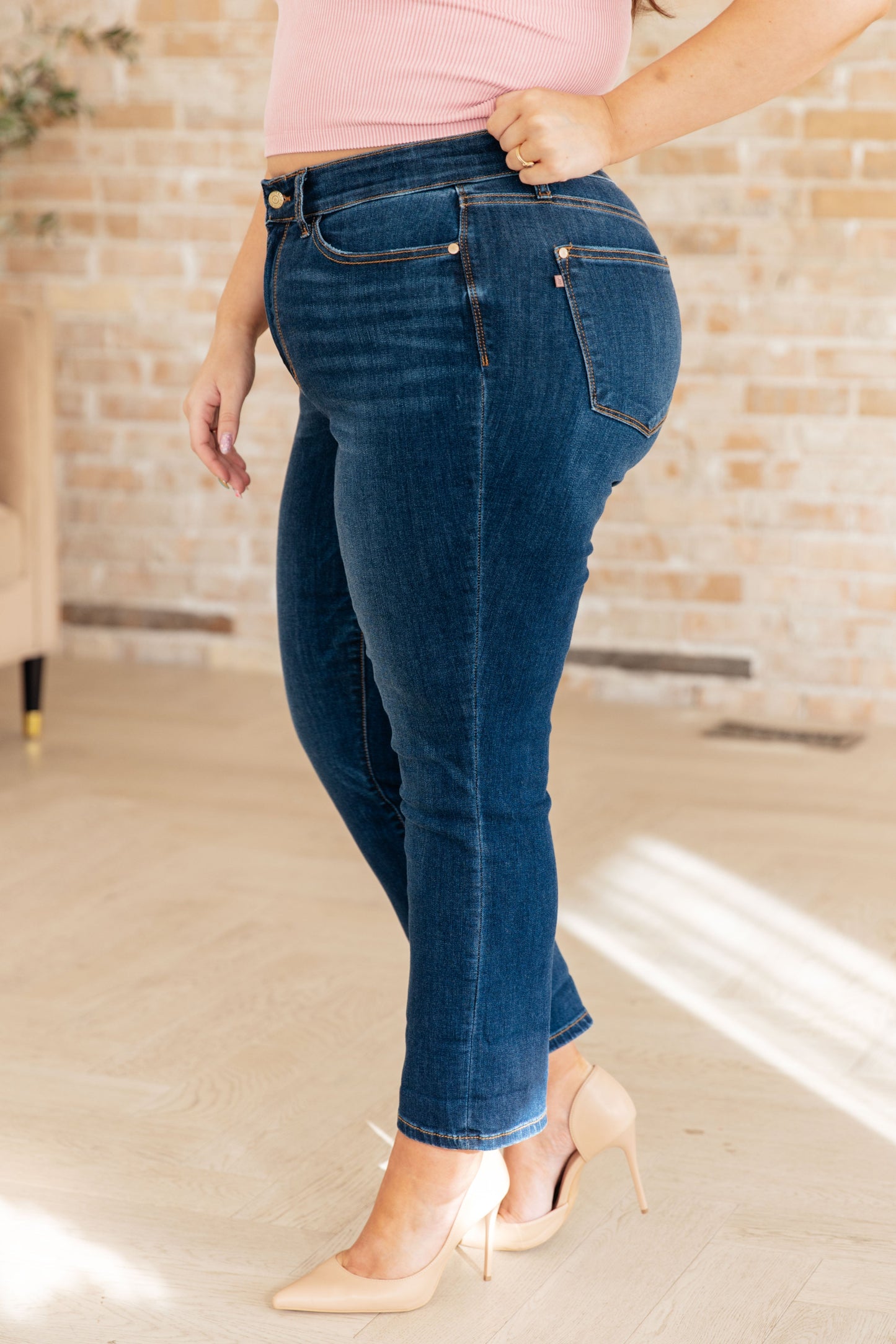 Upgrade your denim game with our Bette Mid Rise Vintage Cuffed Skinny Capri from Judy Blue! Enjoy the comfort of 4-way stretch and the timeless look of the dark vintage wash. Optional cuffed hems add a touch of style to this non-distressed, mid-rise jean. Perfect for a modern twist on a classic favorite. 0 -24W