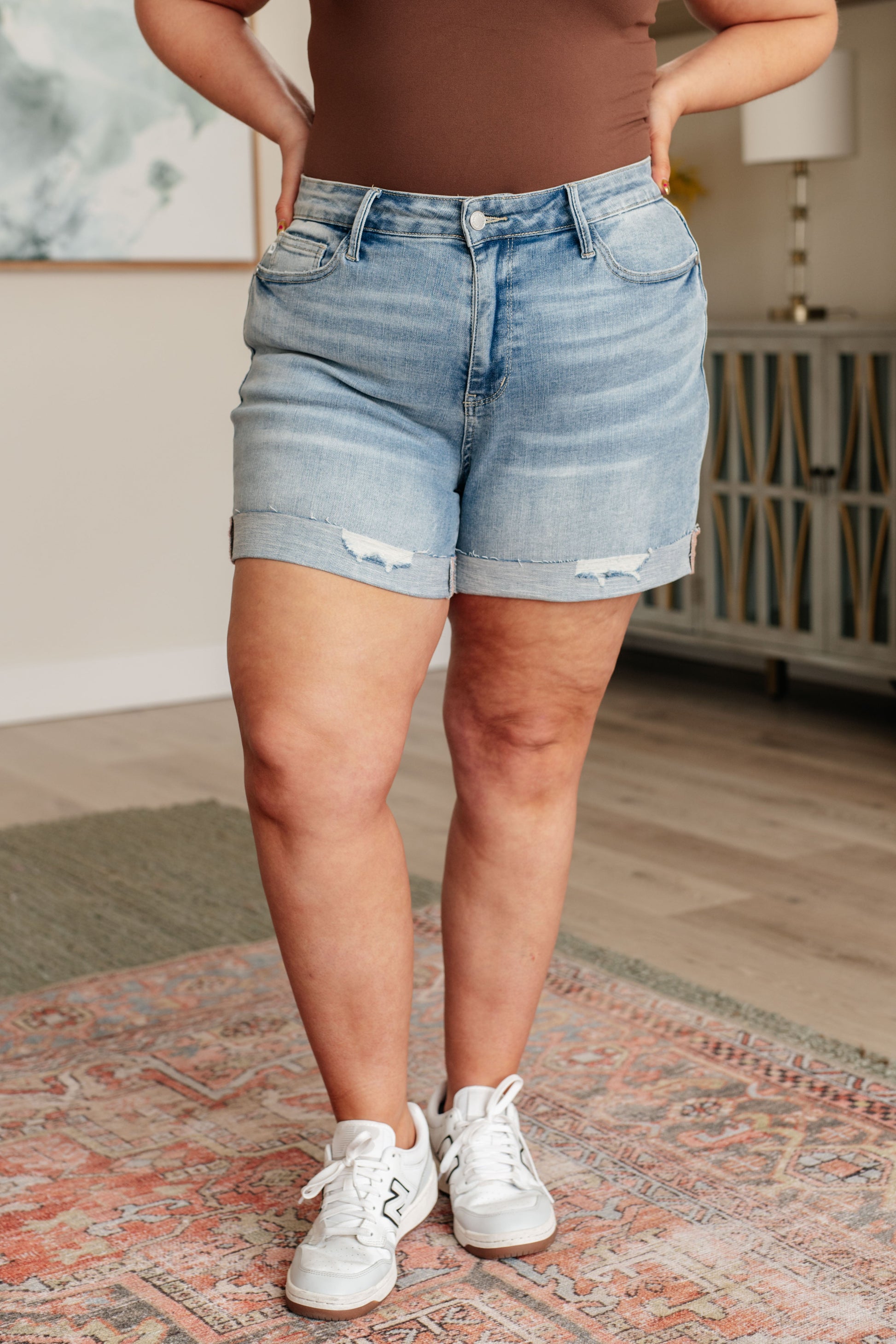 Elevate your style with our Darlene High Rise Distressed Cuffed Cutoff Shorts from Judy Blue! With the perfect inseam for everyday life, these light to medium wash shorts feature a raw cuffed hem and a slight distressed look, giving you a unique and trendy look. Show off your fashion sense and feel confident in these high rise shorts. S-3X