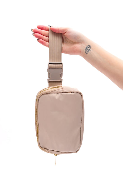 Nylon
Gold and Khaki Hardware
7” x 3.5” Mesh Patch Pocket
Two 3.5” x 3.5” Mesh Patch Pocket
Fully Lined
Sliding Strap Adjuster
Side Release Plastic Strap Buckle
Strap: 22” - 41.5” + 3.5” Hardware
Width: 7.5” Height: 5 1/4” Depth: 1 3/4”