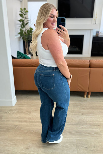 The Hazel High Rise Vintage Wide Leg Jeans are the perfect addition to your denim collection! Featuring a flattering high rise fit and a vintage wide leg cut, these non-distressed jeans are in a classic medium wash that will never go out of style. Get the perfect fit with these timeless jeans.