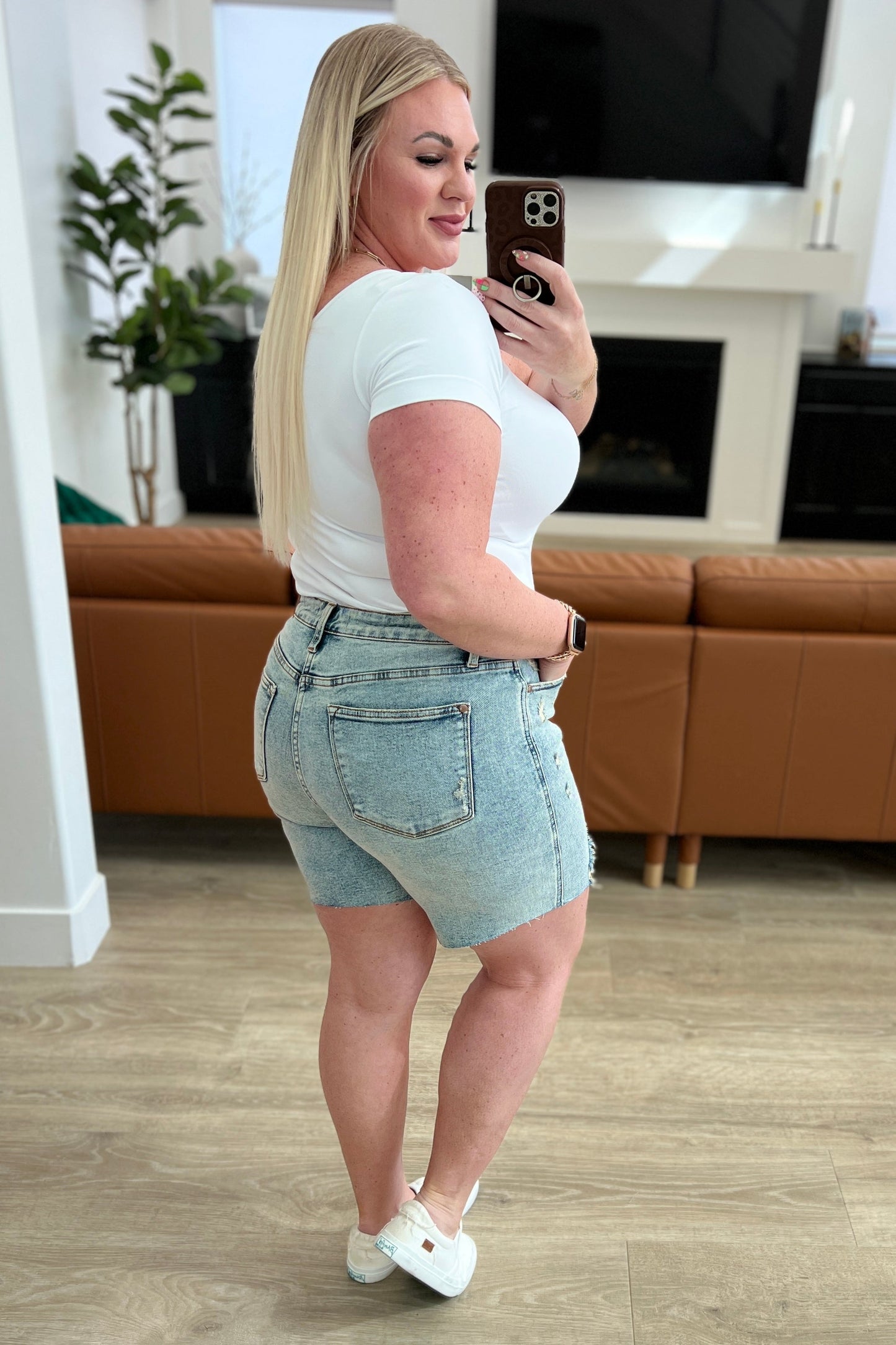 Get ready for some playful vibes with our Cindy High Rise Mineral Wash Distressed Boyfriend Shorts from Judy Blue! Featuring a high rise, comfort fit and 4-way stretch for maximum mobility. The mineral wash and cut off hem add a unique touch to these versatile shorts. Perfect for any day out (or in)! S-3X