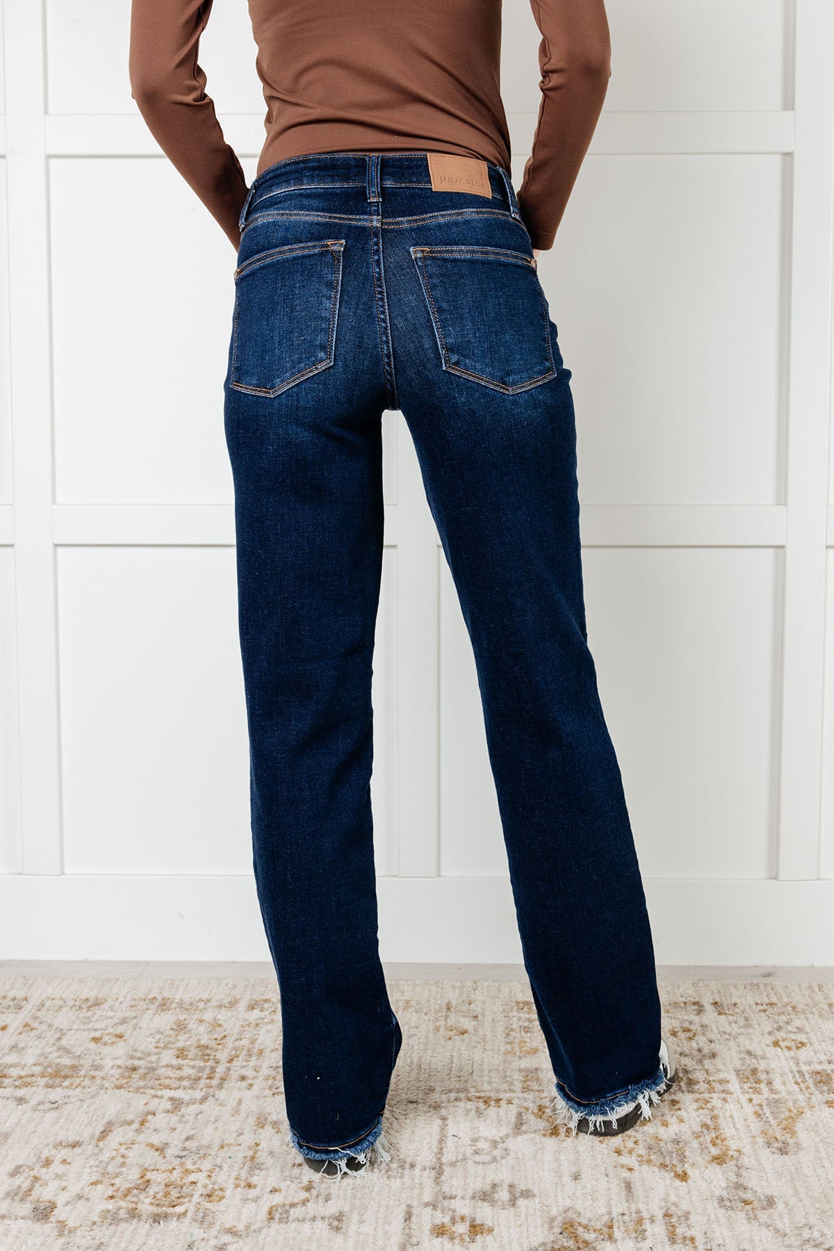 The Jacqueline Mid Rise Jean will elevate your casual look with its dark wash and non-distressed design. The straight leg silhouette flatters any figure, while the frayed hem adds a touch of playful flair. Perfect for any occasion, this jean is a must-have for your wardrobe.

Judy Blue
Mid Rise
Zip Fly
Dark Wash
Straight Leg Silhouette
Raw Hem
93% Cotton, 6% Polyester, 1% Spandex
True to Judy Blue Sizing