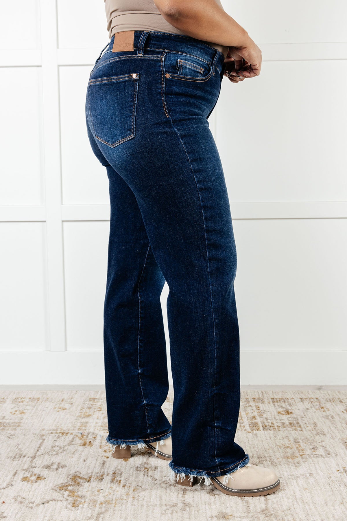 The Jacqueline Mid Rise Jean will elevate your casual look with its dark wash and non-distressed design. The straight leg silhouette flatters any figure, while the frayed hem adds a touch of playful flair. Perfect for any occasion, this jean is a must-have for your wardrobe.

Judy Blue
Mid Rise
Zip Fly
Dark Wash
Straight Leg Silhouette
Raw Hem
93% Cotton, 6% Polyester, 1% Spandex
True to Judy Blue Sizing